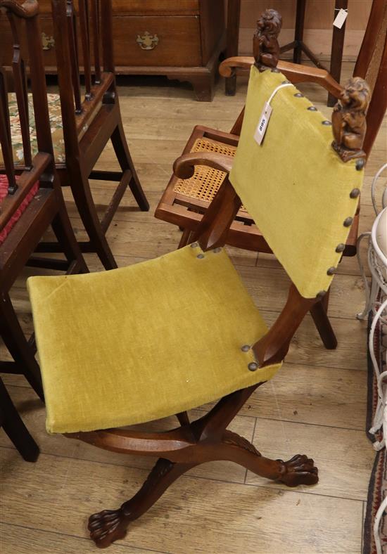 An early 20th century French carved walnut X frame side chair